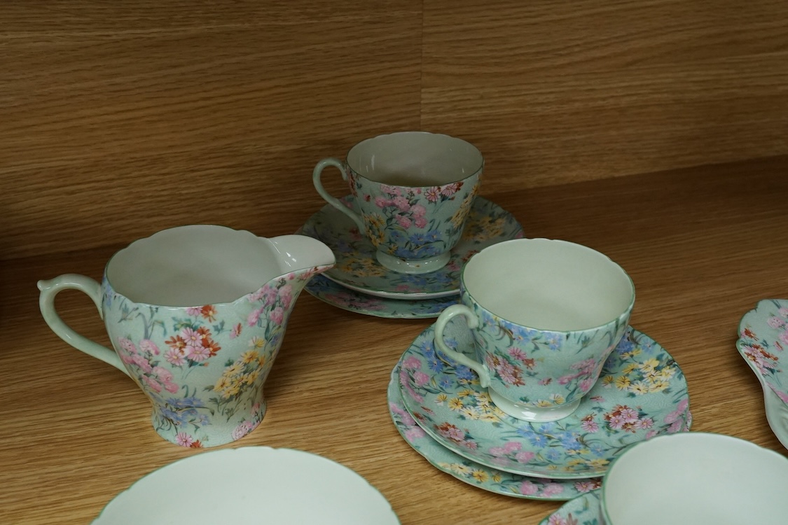 A Shelley ‘Melody’ porcelain six cup tea set, teapot missing, cake plate 25cm square (21)